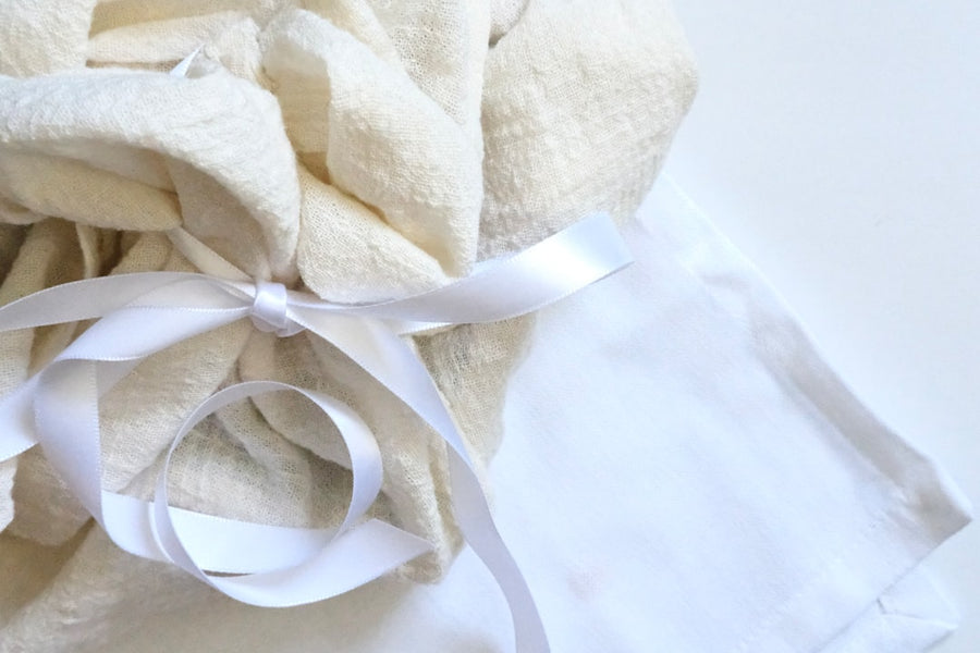 A small wrapped gift held in two hands